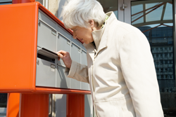 senior woman at mailbox